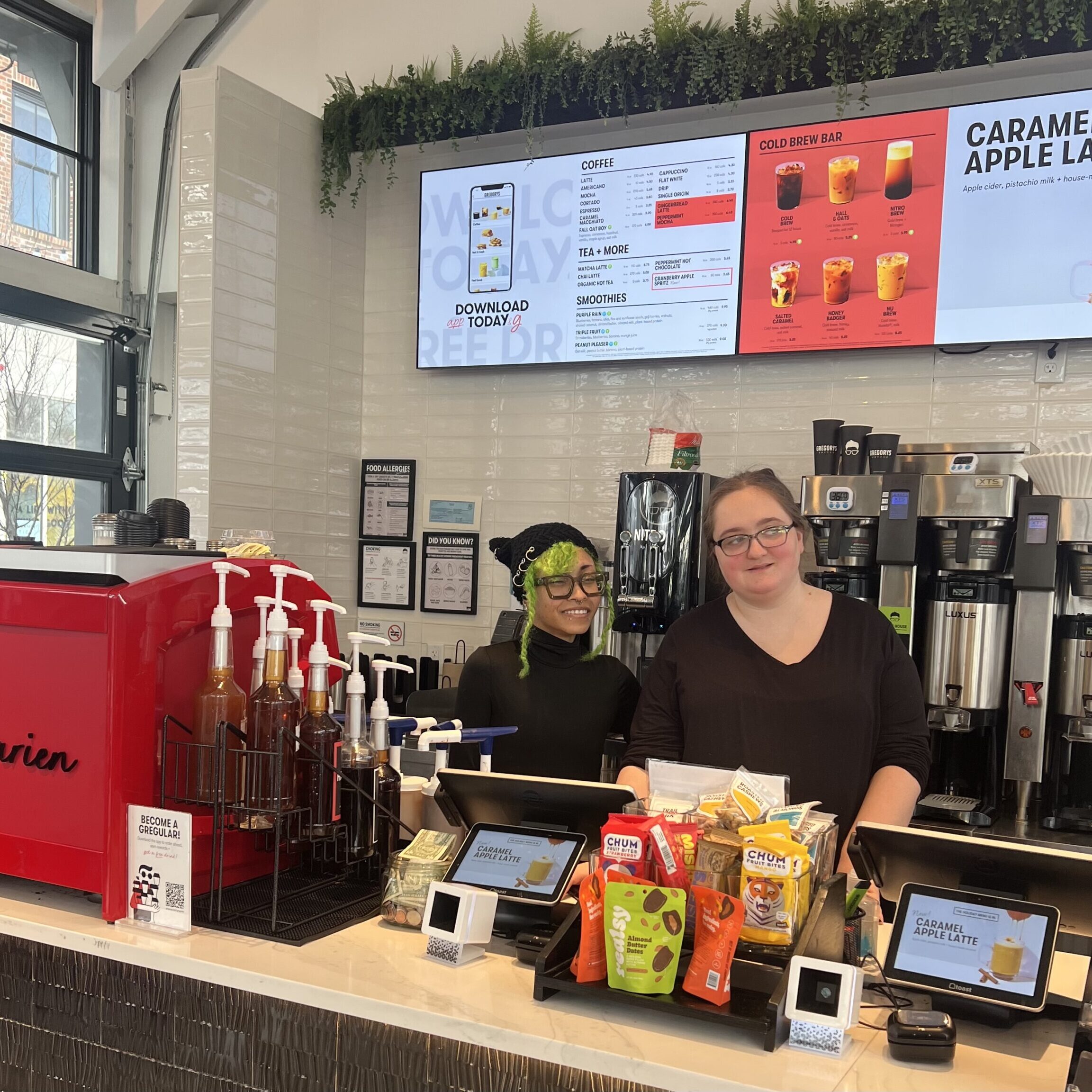 Abigail working at the POS at Gregorys.